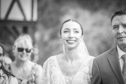 Bride walking down the aisle at a country wedding