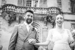 Guests laughing during a country wedding in France