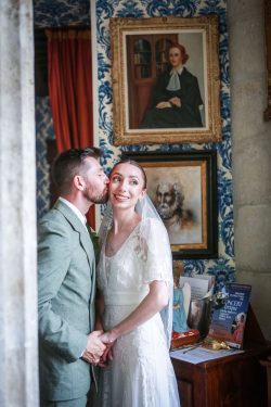 Newlyweds sharing a kiss during their country wedding