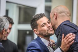 Wedding guests celebrating with groom in South West France