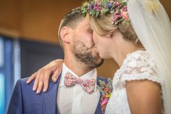 Newlyweds sharing a kiss during their french wedding
